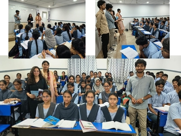 Two men in bicycle jerseys sitting outside at table having coffee